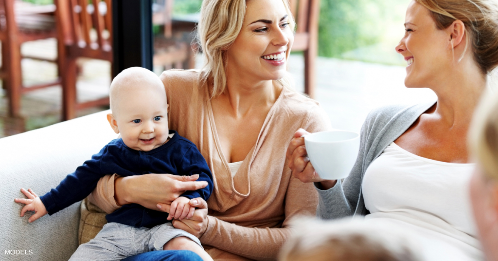 Mothers in discussion about their mommy makeover recovery.