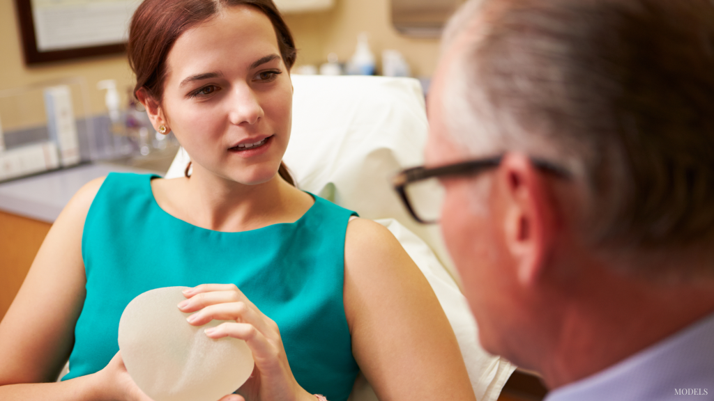 Woman asking questions at breast augmentatio consultation in Grapevine, TX.