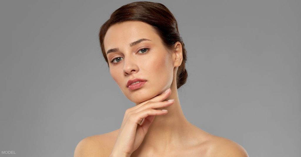 Beautiful woman with hand under her chin (MODEL)